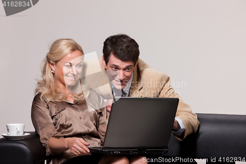 Image of Young Woman And Man with a notebook