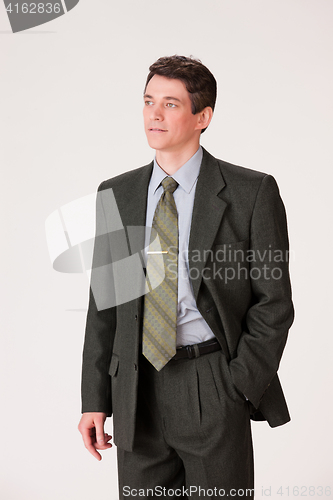 Image of Young Emotional Man In A Business Suit