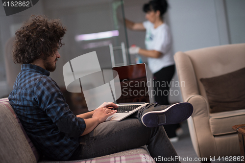 Image of man working with laptop