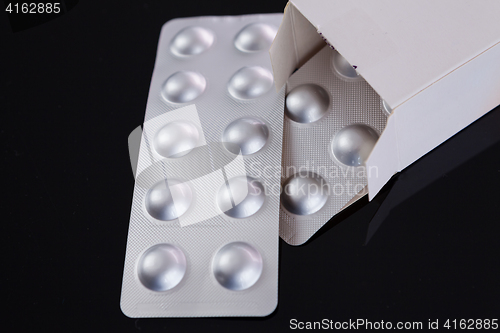 Image of Silver blister pack of small pills