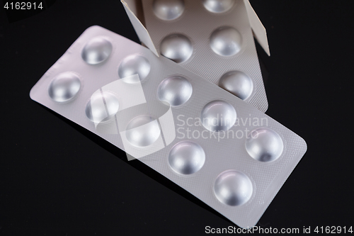 Image of Silver blister pack of small pills