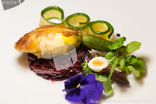 Image of Delicious biscuit with beets, zucchini and pansy