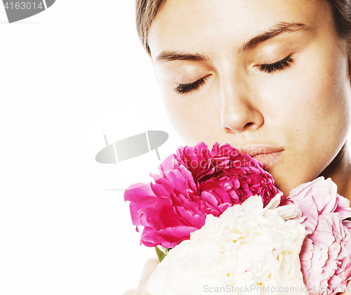 Image of young beauty woman with flower peony pink closeup makeup soft te