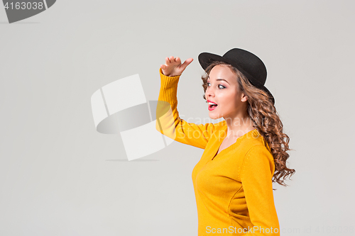 Image of The profile of girl in hat