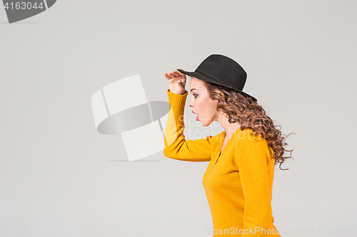 Image of The profile of girl in hat