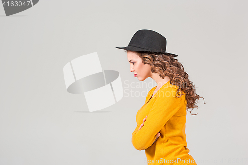 Image of The profile of girl in hat