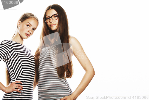 Image of two young workers isolated on white, same dresses in strip