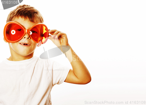 Image of little cute boy in orange sunglasses pointing isolated close up 