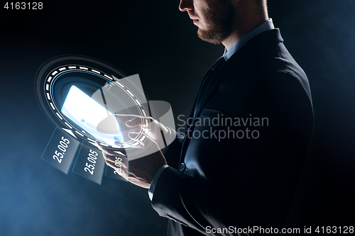 Image of close up of businessman with transparent tablet pc