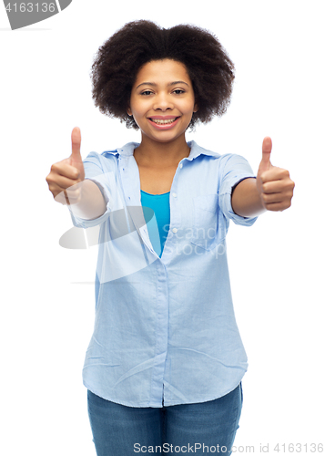 Image of happy african american woman showing thumbs up