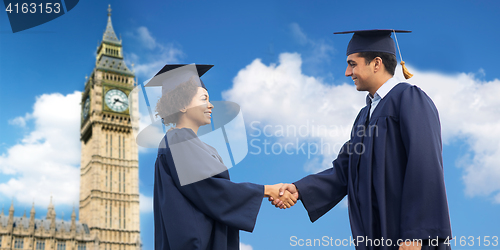 Image of happy students or bachelors greeting each other