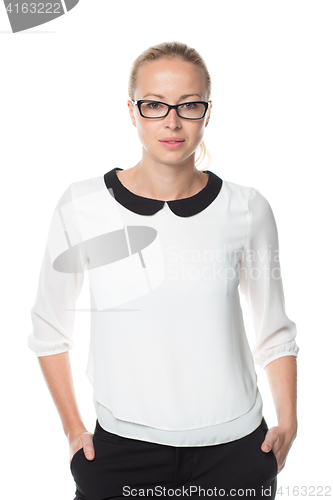 Image of Business woman standing arms in pockets against white background..