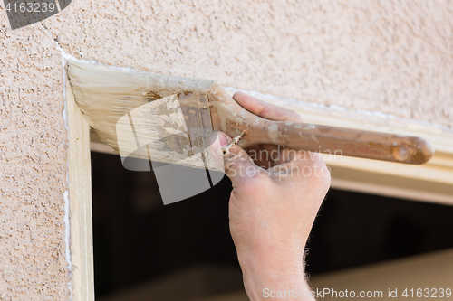 Image of Professional Painter Cutting In With Brush to Paint House Door F