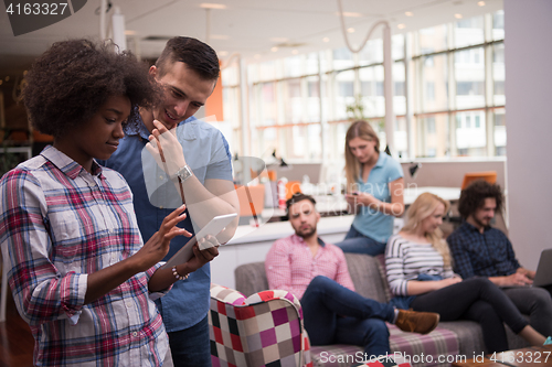 Image of Multiethnic startup business team on meeting two in front of the