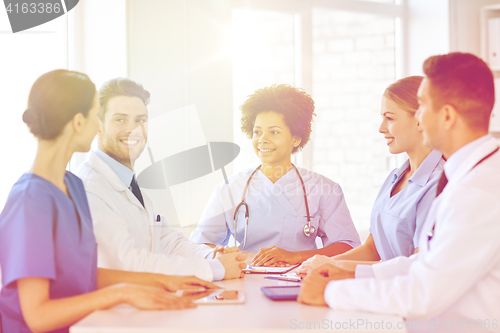 Image of group of happy doctors meeting at hospital office