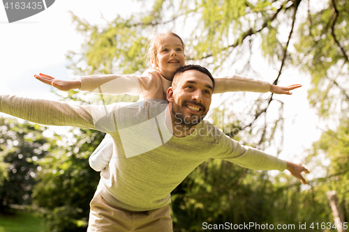 Image of happy family having fun in summer park