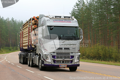 Image of Silver Volvo FH Logging Truck on Foggy Morning