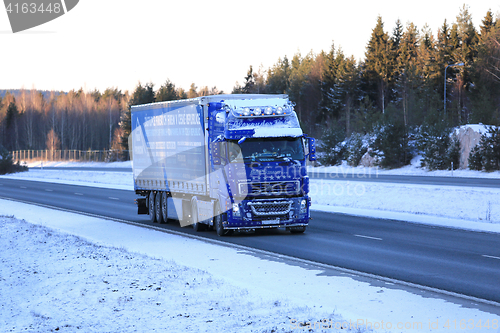 Image of Frosted Blue Volvo FH12 Semi Truck on Winter Road