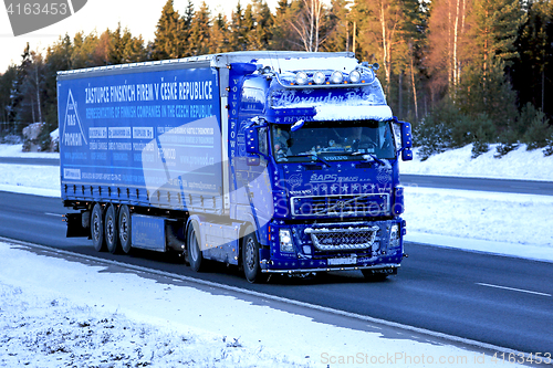 Image of Blue Volvo FH12 460 Semi Truck Trucking in Snow and Ice 