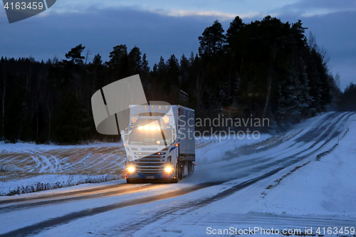 Image of Customized Super Scania Truck Transport on Winter Road