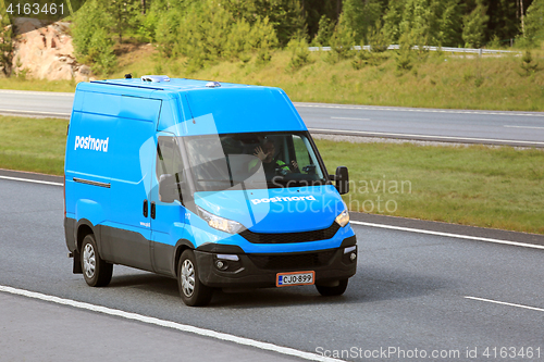 Image of Blue Delivery Van at Speed
