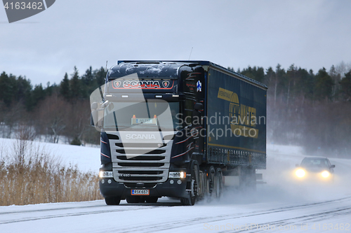 Image of Scania R450 Semi Truck Transport on Winter Roads