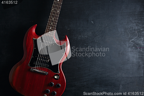 Image of Electric guitar on wooden background