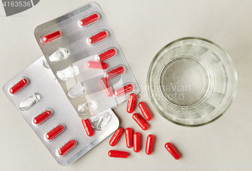 Image of red medicine pills