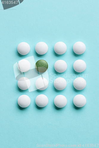 Image of white and green pills