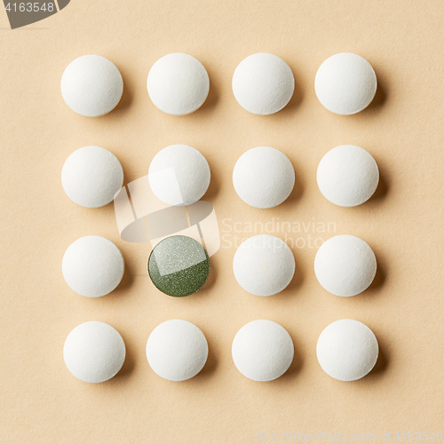Image of white and green pills