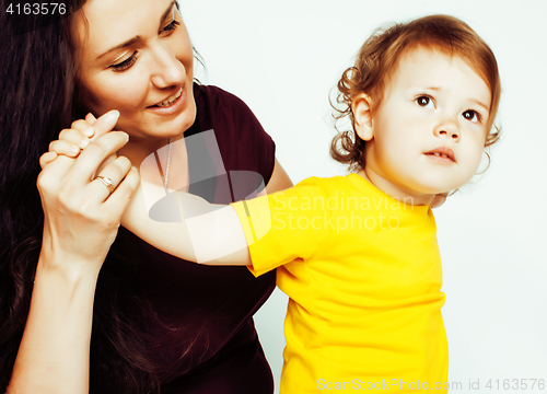 Image of pretty real normal mother with cute blond little daughter close up isolated on white background, lifestyle people concept