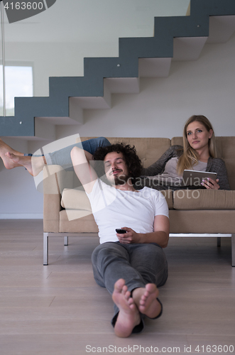 Image of young couple relaxes in the living room