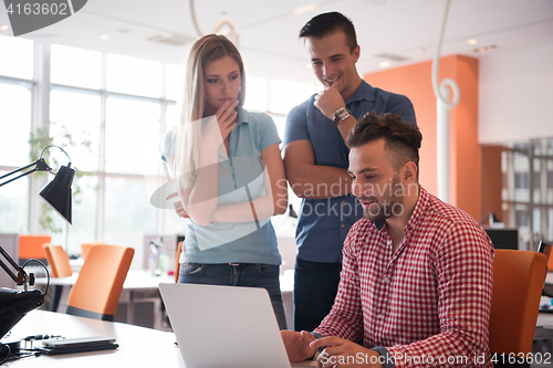 Image of Group of young people employee workers with computer