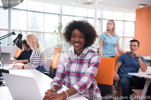 Image of African American informal business woman working in the office