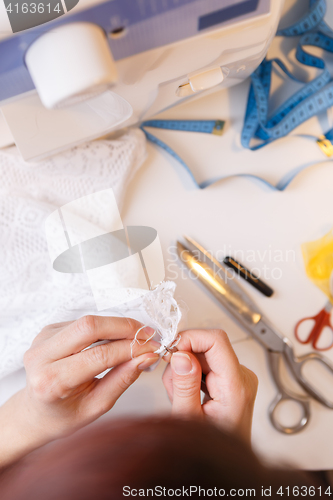 Image of Young woman engaged in handicrafts