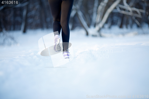 Image of Athlete running in winter park