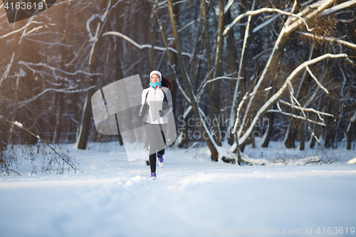 Image of Young woman on morning jog