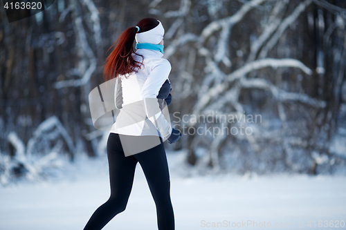 Image of Brunette goes in for sports