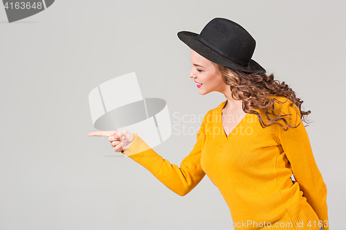 Image of The profile of girl in hat