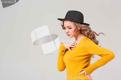 Image of The profile of girl in hat