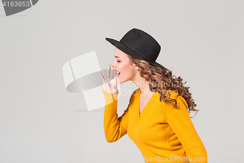 Image of The profile of girl in hat