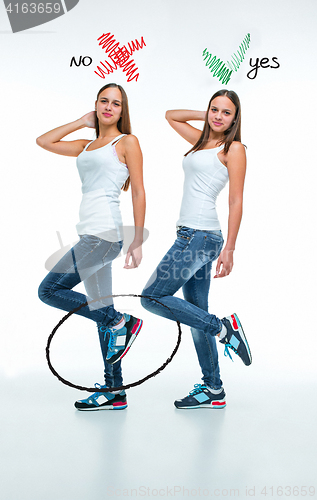 Image of conceptual portrait of two beautiful twin young women