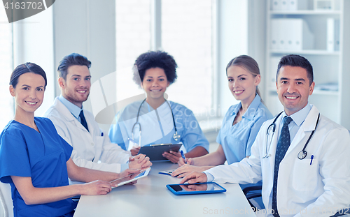 Image of group of happy doctors meeting at hospital office