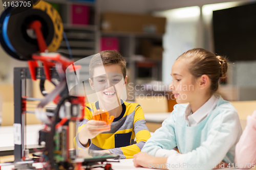 Image of happy children with 3d printer at robotics school