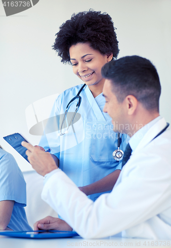 Image of group of happy doctors meeting at hospital office