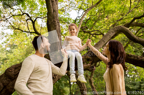 Image of happy family in summer park having fun