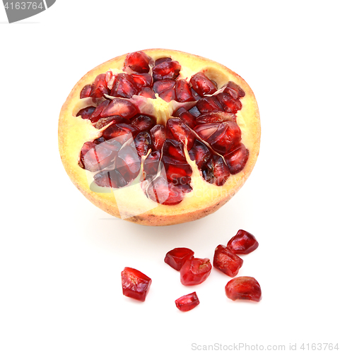Image of Cut half pomegranate with seeds removed