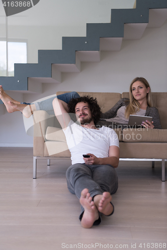 Image of young couple relaxes in the living room