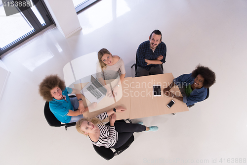 Image of Multiethnic startup business team on meeting  top view