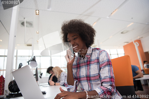 Image of African American informal business woman working in the office